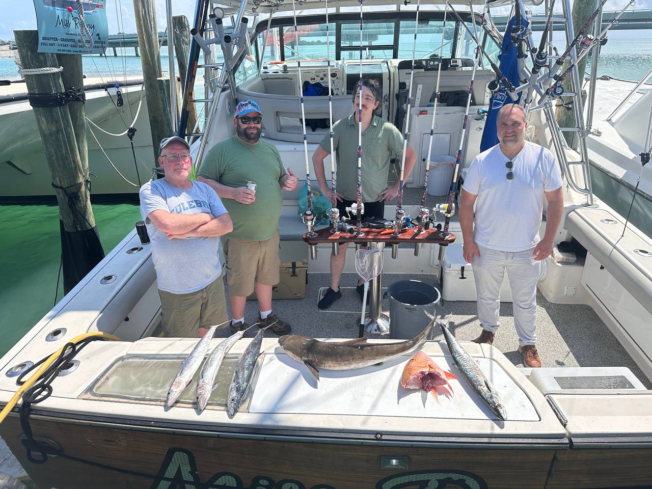 Miss Penny crew and anglers posing with their catch after a reef trip in Islamorada
