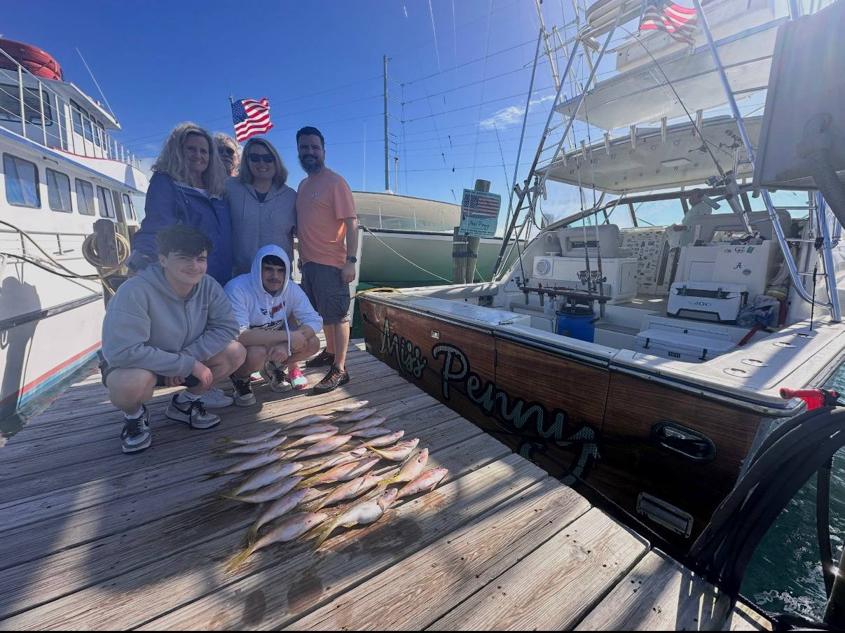 Miss Penny crew and anglers at the dock after a successful reef trip in Islamorada